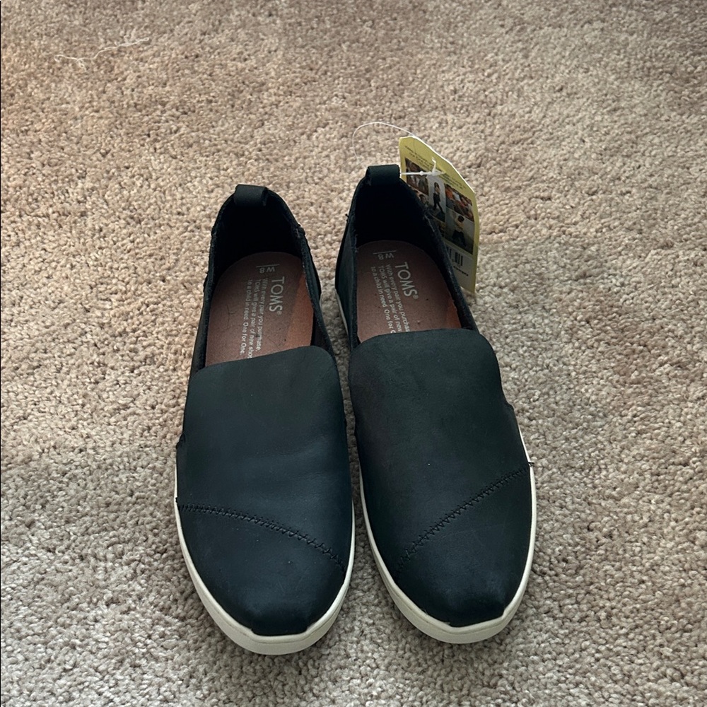 TOMS Black Slip-On Moccasins with White Sole